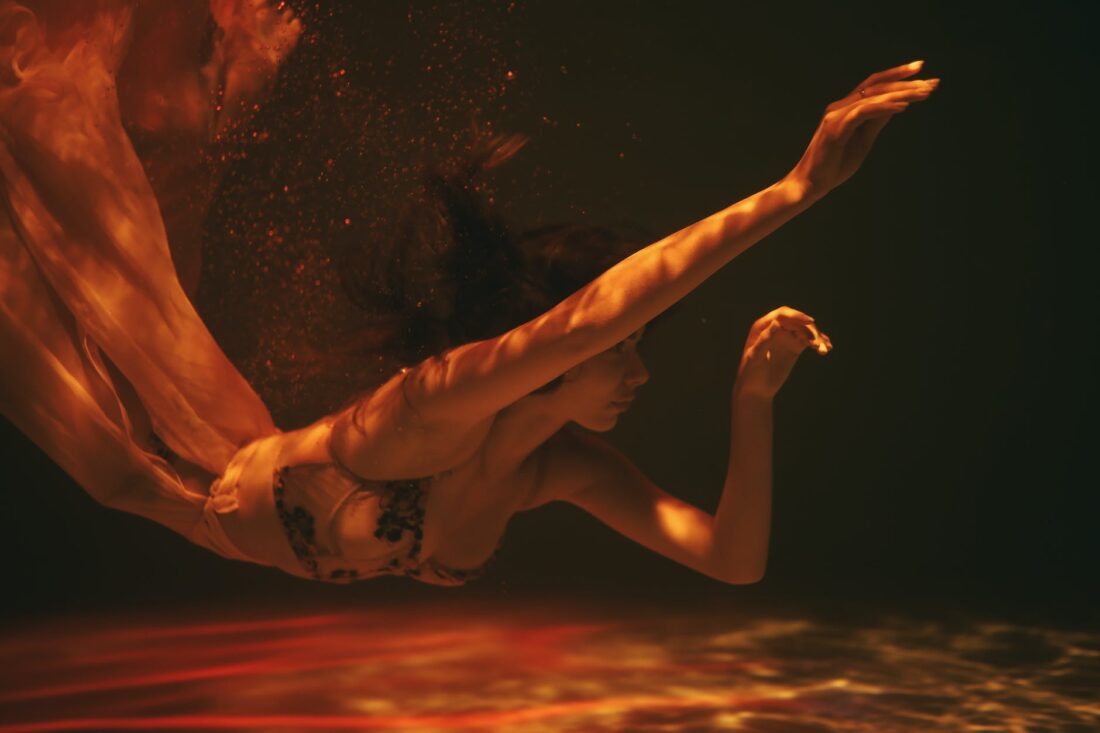 woman swimming underwater